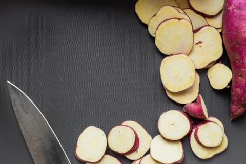 High angle view of chopped sweet potato on a dark background in a studio Stock Photos