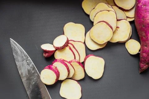 High angle view of chopped sweet potato on a dark background in a studio Stock Photos