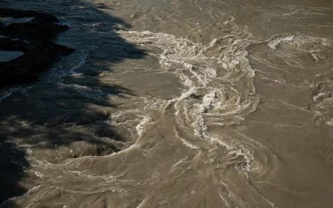 High Angle View of Churning Muddy River Water Current Stock Photos