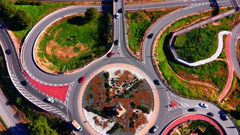 High angle view of circular traffic junction with cars Stock Footage 334860411