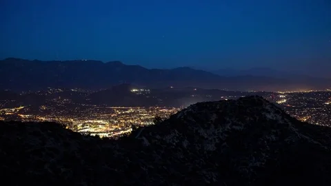 High Angle View of City Between Mountains at Dusk Video stock 76852638