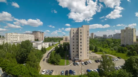 High angle view of city residential buildings under moving clouds in daytim.. Stock Footage 337181297