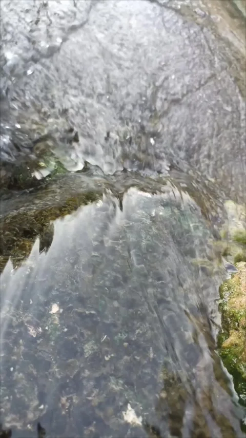 High angle view of clean stream water rushing over wet rocks Video stock 339737949