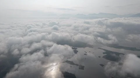 High angle view of clouds with sunlight piercing through Stock Footage 339825070