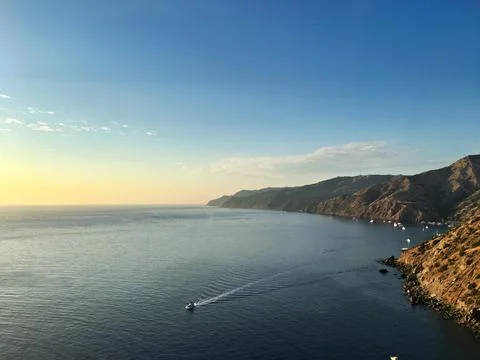 High Angle View Of Coastal Cliffs And Blue Ocean with Boat Stock Photos