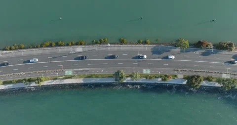 High-angle view of a coastal road with bike lanes. Tamaki Dr, Hobson Bay, Stock Footage 296043063