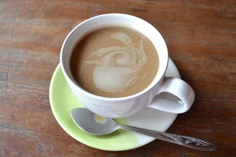 High angle view of coffee cup on wooden table Stock Photos