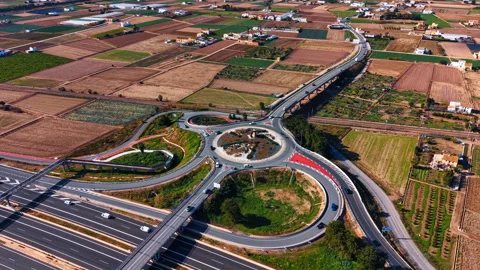 High angle view of complex roundabout and fields Stock Footage 330864842