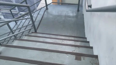 High angle view of concrete stairs with metal handrails in an office building. Видео 334324495