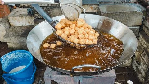 High angle view. The cooking process of Crispy Pong Tofu in deep frying hot pan Stock Photos