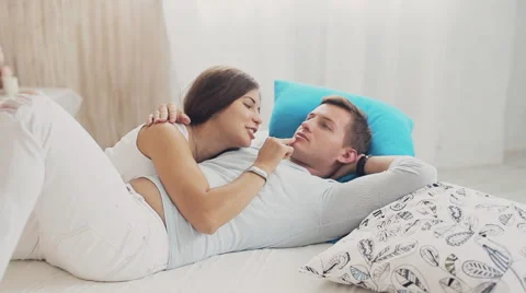 High angle view of couple hugging in bed Video stock 68557608