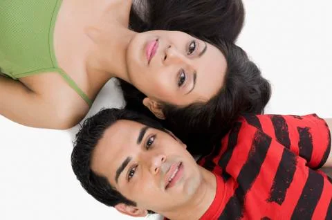 High angle view of a couple lying on the floor and smiling Fotos Stock