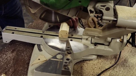 High angle view of a craftman is working on electric saw machine. Sawing a large Stock Footage 121451014