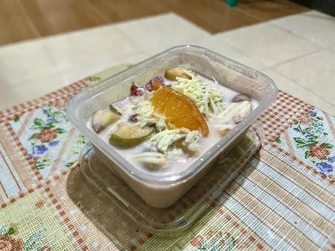 High Angle View of Creamy Fruit Salad with Cheese Topping Stock Photos