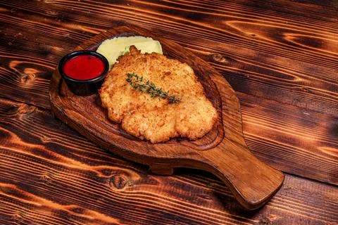 High Angle View of Crispy Breaded Cutlet with Mashed Potatoes and Sauce Stock Photos