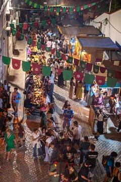 High angle view of crowd, food stalls at medieval fair Silves Portugal Foto stock