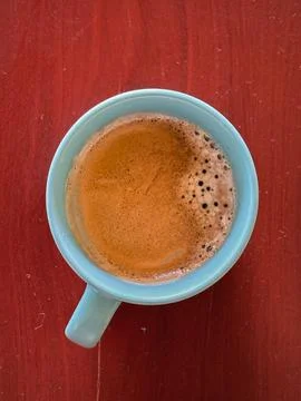 High angle view of cup of coffee on wood table Stock Photos