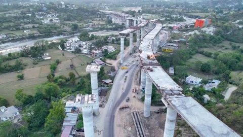 High angle view of curved unfinished highway bridge construction  Видео 335643636