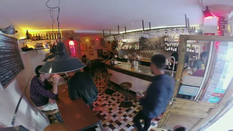 High Angle View of Customers Socializing Inside Busy Paris Beer Bar 库存影片 344953854