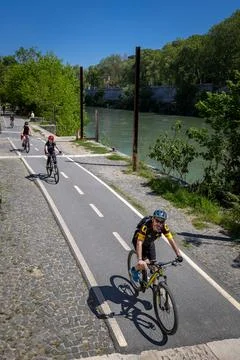 High angle view of cyclists on the Tiber river bicycle lane. Stock Photos