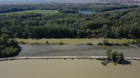 High angle view of Danube River flooding into the forest and the road, 4k Stock Footage 342939277