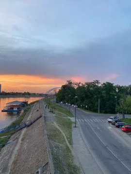 High-angle view of the Danube riverside promenade in Novi Sad, Serbia, at sunset Stock Photos