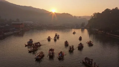 High-angle view of dawn-lit boats and quiet community, Thailand Stock Footage 309154683