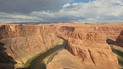 High-angle view of a deep river canyon winding through massive red rock forma 16 Stock-Footage 343303537