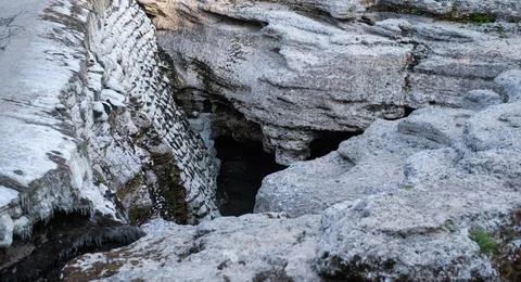 High-angle view of a deep rocky cleft and dry limestone formations Stock Photos