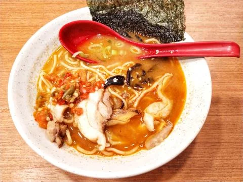 High angle view of a delicious hot spicy warming japanese ramen noodles soup Фото