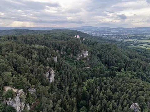 High angle view of dense pine forest, hilltop castle ruins, rocky ridges, d.. Stock Photos