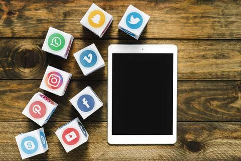 High angle view digital tablet near boxes with media icons High resolution photo Stock Photos