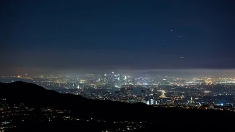 High Angle View of Downtown Los Angeles with Planes Passing Overhead Video stock 76854903