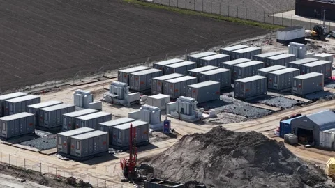 High angle view of drilling rig on site constructing a large battery storage Stock Footage 334784319