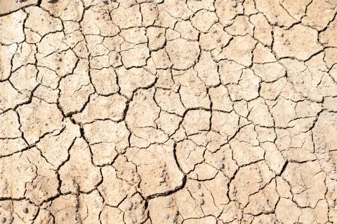 High-angle view of dry, cracked earth texture during a severe drought, show.. Fotos de archivo