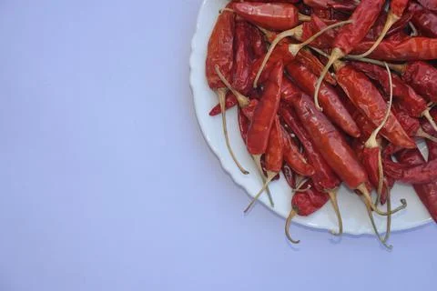 High angle view of dry red chilli peppers on the white  Stock Photos