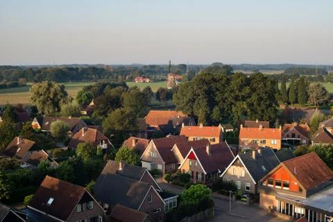 High angle view of dutch rural village lit by early morning sun. Stock Photos
