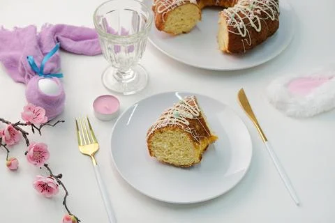 High angle view Easter table setting, glazed Easter cake and candles on table Stock Photos