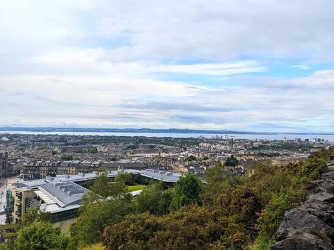 High angle view of Edinburghs sprawling cityscape towards the Firth of Forth on Stock Photos