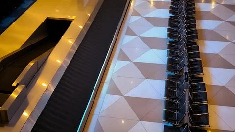 High angle view of empty airport terminal seating and baggage belt. Fotos Stock
