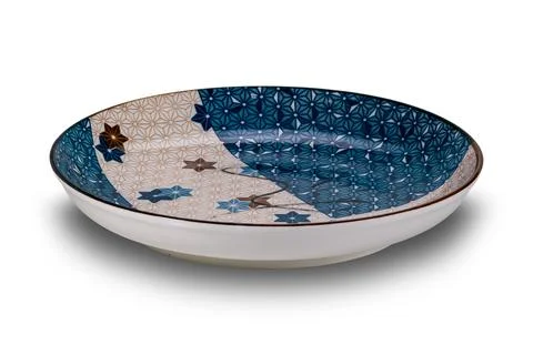 High angle  view of empty blue and brown star pattern dark edge ceramic plate. Stock Photos