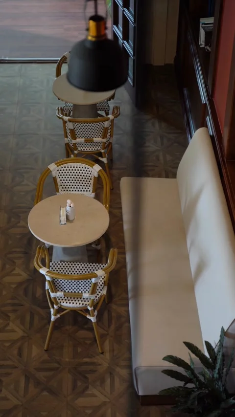 High Angle View of an Empty Cafe Interior with Elegant Seating Stock Footage 335963661