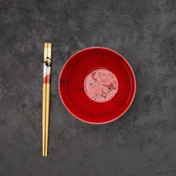 High angle view empty chinese bowl wooden chopsticks textured black background 스톡 사진