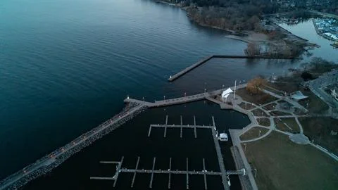 High Angle View of Empty Marina Boat Slips and Promenade Pier at Sunrise Stock Photos