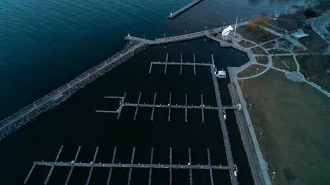 High Angle View of Empty Marina Boat Slips and Promenade Pier at Sunrise Stock Photos