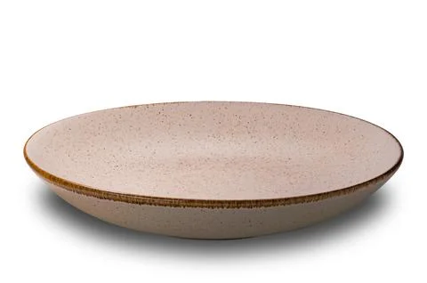 High angle view of empty spotted brown ceramic bowl with dark edge. Stock Photos