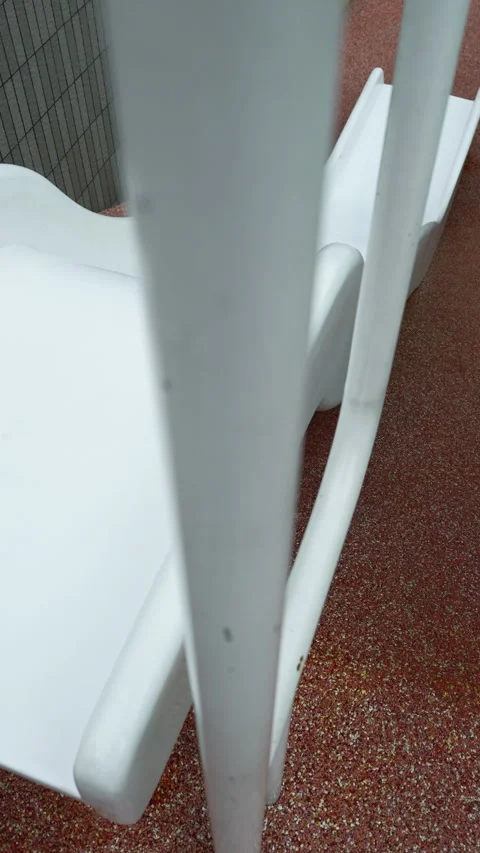 High-angle view of an empty white modern wavy playground slide. Stock Footage 340390641