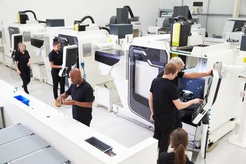High Angle View Of Engineering Workshop With CNC Machines Stock Photos