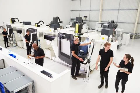 High Angle View Of Engineering Workshop With CNC Machines Stock Photos