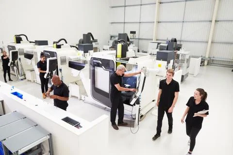 High Angle View Of Engineering Workshop With CNC Machines Stock Photos